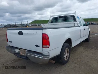 2000 Ford F-150 XL with VIN 1FTRX17W5YKB03384, listed as a IAAI auction lot 41723526 with 281,658 mi miles. Bid and sale history available at carsss.com. Image 4.