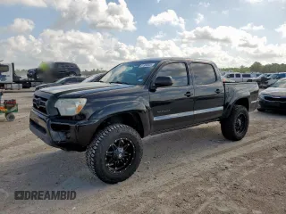 2014 Toyota Tacoma PreRunner with VIN 5TFJX4GN9EX029908, listed as a Copart auction lot 61986805 with 102,532 mi miles and Salvage title. Bid and sale history available at DreamBid. Image 1.