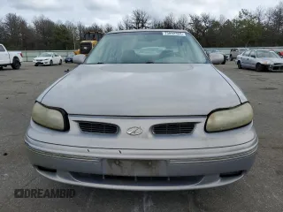 1999 Oldsmobile Cutlass GLS z VIN 1G3NG52J3X6333871, wystawiony jako Copart lot #73892304 z przebiegiem 44 280 mil mil oraz Tytuł czysty. Historia ofert i sprzedaży dostępna na DreamBid. Obrazek 5.