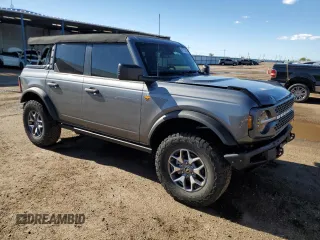 2023 Ford Bronco with VIN 1FMEE5DP0PLC10002, listed as a Copart auction lot 57272555 with 14,035 mi miles and Salvage title. Bid and sale history available at DreamBid. Image 4.