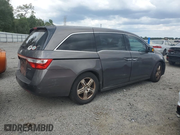 2012 Honda Odyssey Touring with VIN 5FNRL5H94CB102177, listed as a Copart auction lot 55942185 with 179,418 mi miles and Salvage Title. Bid and sale history available at DreamBid. Image 3.