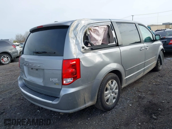 2015 Dodge Grand Caravan SE with VIN 2C4RDGBG8FR612296, listed as a IAAI auction lot 42112920 with 137,023 mi miles and . Bid and sale history available at DreamBid. Image 4.