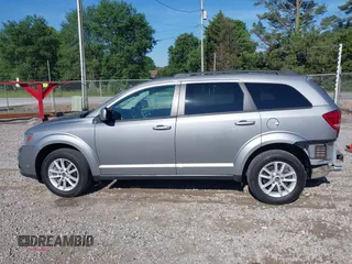 2017 Dodge Journey SXT z VIN 3C4PDCBG4HT563310, wystawiony jako IAAI lot #42190636 z przebiegiem 171 054 mil mil oraz . Historia ofert i sprzedaży dostępna na DreamBid. Obrazek 14.