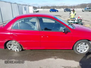 2002 Kia Rio with VIN KNADC123526160314, listed as a IAAI auction lot 41527989 with 124,252 mi miles. Bid and sale history available at carsss.com. Image 14.