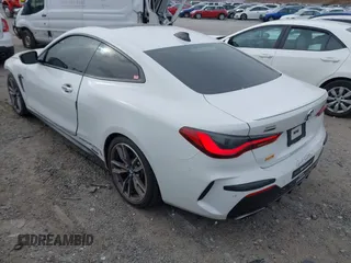 2021 BMW 4 Series M440i xDrive with VIN WBA13AR06MCF78418, listed as a IAAI auction lot 41257716 with 35,974 mi miles and . Bid and sale history available at carsss.com. Image 3.