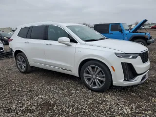 2020 Cadillac XT6 FWD Premium Luxury with VIN 1GYKPCRS0LZ173389, listed as a Copart auction lot 45647475 with 52,933 mi miles and Salvage Title. Bid and sale history available at carsss.com. Image 4.
