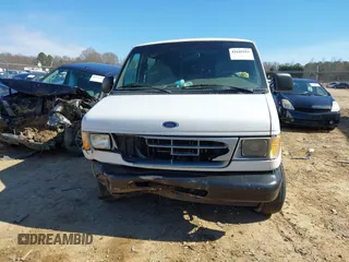 1999 Ford Econoline Cargo with VIN 1FTRE14W0XHB64440, listed as a IAAI auction lot 41645551 with 239,114 mi miles. Bid and sale history available at carsss.com. Image 12.