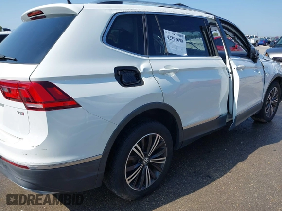 2018 Volkswagen Tiguan SEL z VIN 3VV3B7AX5JM091021, wystawiony jako IAAI lot #42392698 z przebiegiem 107 595 mil mil oraz . Historia ofert i sprzedaży dostępna na DreamBid. Obrazek 13.