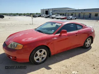 2003 Hyundai Tiburon GT z VIN KMHHN65F53U041351, wystawiony jako Copart lot #52332395 z przebiegiem 194 821 mil mil oraz Czysty tytuł • Clean title. Historia ofert i sprzedaży dostępna na DreamBid. Obrazek 1.