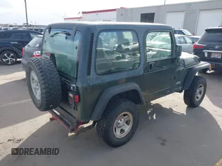 1998 Jeep Wrangler SE with VIN 1J4FY29P1WP760687, listed as a IAAI auction lot 41720889 with 210,592 mi miles. Bid and sale history available at carsss.com. Image 4.