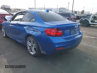 2015 BMW 2 Series 228i with VIN WBA1F5C59FVW98205, listed as a IAAI auction lot 41722804 with 91,879 mi miles. Bid and sale history available at carsss.com. Image 3.