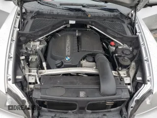 2012 BMW X5 35i with VIN 5UXZV4C57CL747717, listed as a Copart auction lot 63003135 with 135,999 mi miles and Clean title. Bid and sale history available at DreamBid. Image 12.
