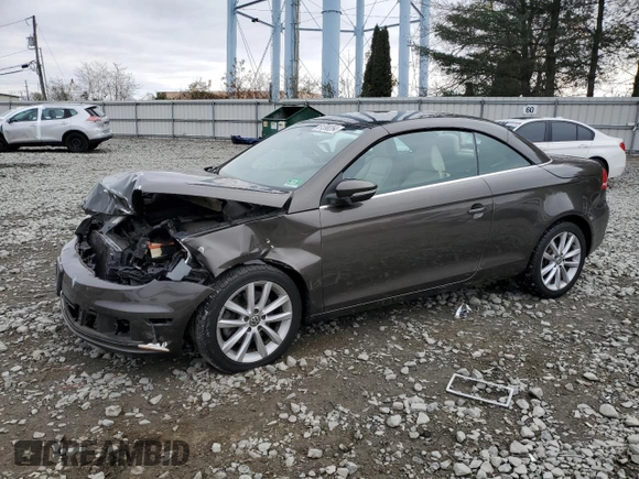 2015 Volkswagen Eos Komfort with VIN WVWBW8AH3FV000399, listed as a Copart auction lot 81398264 with 82,533 mi miles and Salvage Title. Bid and sale history available at DreamBid. Image 1.
