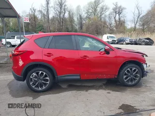 2016 Mazda CX-5 Grand Touring with VIN JM3KE4DY9G0865780, listed as a IAAI auction lot 41913914 with 76,579 mi miles. Bid and sale history available at carsss.com. Image 14.