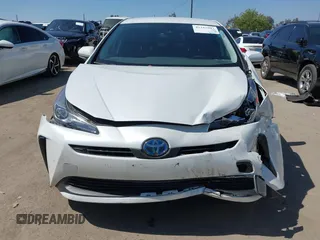 2021 Toyota Prius L Eco with VIN JTDKAMFU8M3135142, listed as a IAAI auction lot 42317007 with 77,353 mi miles and . Bid and sale history available at DreamBid. Image 12.