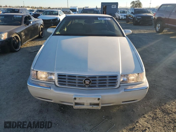 2002 Cadillac Eldorado z VIN 1G6EL12Y12B100821, wystawiony jako Copart lot #83495214 z przebiegiem 36 358 mil mil oraz Czysty tytuł • Clean title. Historia ofert i sprzedaży dostępna na DreamBid. Obrazek 5.