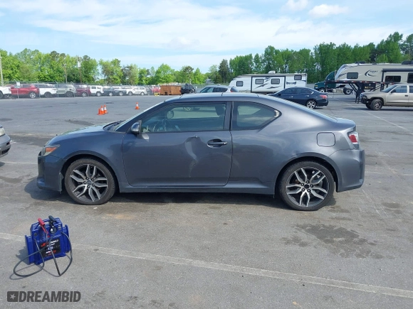 2015 Scion tC with VIN JTKJF5C71FJ013747, listed as a IAAI auction lot 42087740 with 138,097 mi miles. Bid and sale history available at carsss.com. Image 14.
