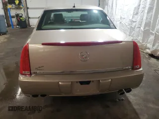2006 Cadillac DTS 1SC z VIN 1G6KD57Y76U141402, wystawiony jako Copart lot #58715675 z przebiegiem 148 042 mil mil oraz Szkoda całkowita • Salvage title. Historia ofert i sprzedaży dostępna na DreamBid. Obrazek 6.