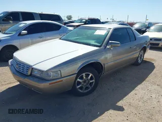 2001 Cadillac Eldorado Touring ETC z VIN 1G6ET12971B109319, wystawiony jako IAAI lot #41682779 z przebiegiem 147 515 mil mil oraz . Historia ofert i sprzedaży dostępna na DreamBid. Obrazek 2.