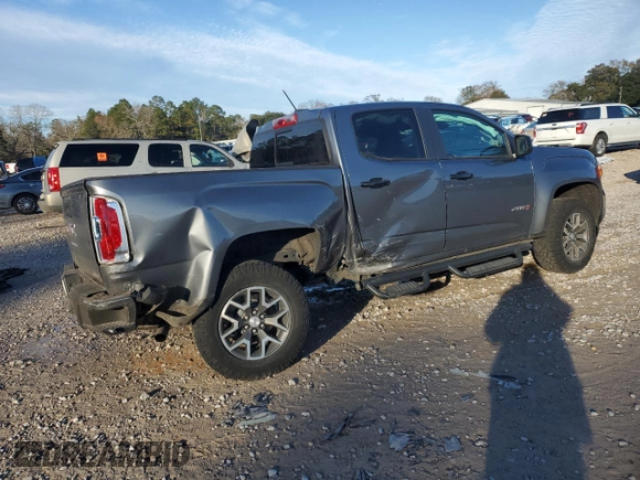 2021 GMC Canyon 4WD AT4 w/Leather with VIN 1GTG6FEN7M1156069, listed as a Copart auction lot 89345225 with 66,164 mi miles and Salvage Title. Bid and sale history available at carsss.com. Image 3.
