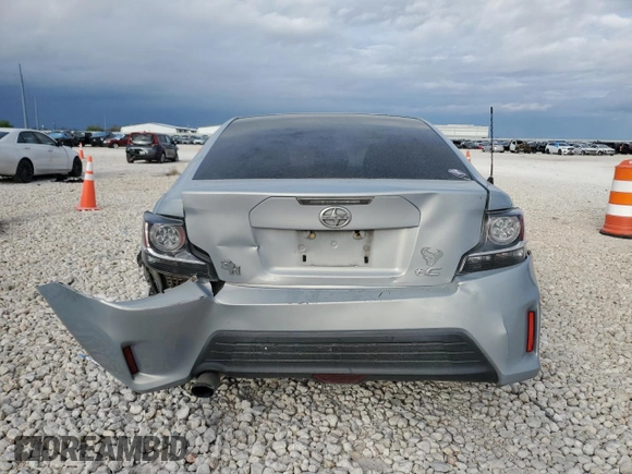 2014 Scion tC z VIN JTKJF5C79E3067932, wystawiony jako Copart lot #50425555 z przebiegiem Nie podano mil oraz Szkody całkowita. Historia ofert i sprzedaży dostępna na DreamBid. Obrazek 6.