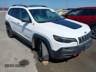 2021 Jeep Cherokee Trailhawk z VIN 1C4PJMBX1MD145169, wystawiony jako IAAI lot #42340464 z przebiegiem 50 925 mil mil oraz . Historia ofert i sprzedaży dostępna na DreamBid. Obrazek 1.