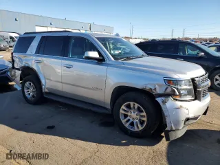 2020 Chevrolet Tahoe LT with VIN 1GNSKBKCXLR157872, listed as a Copart auction lot 79806594 with 129,729 mi miles and Salvage Title. Bid and sale history available at carsss.com. Image 4.