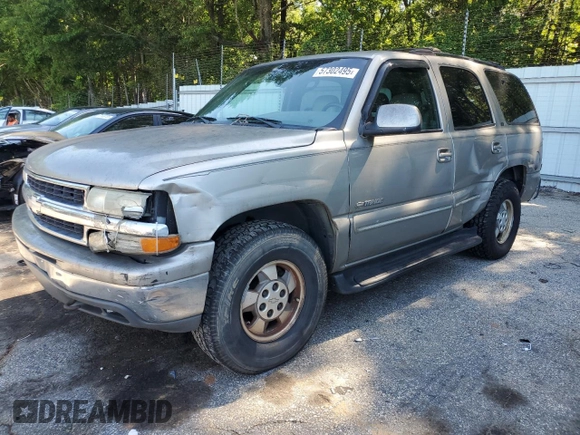 2000 Chevrolet Tahoe LS with VIN 1GNEK13T2YJ203710, listed as a Copart auction lot 57302495 with 237,227 mi miles and Salvage title. Bid and sale history available at DreamBid. Image 1.