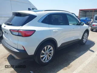 2021 Ford Escape Titanium with VIN 1FMCU9J91MUA29407, listed as a IAAI auction lot 42120442 with 19,314 mi miles and . Bid and sale history available at DreamBid. Image 4.