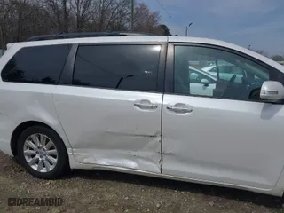 2015 Toyota Sienna XLE with VIN 5TDYK3DC0FS570007, listed as a IAAI auction lot 41794333 with 217,512 mi miles. Bid and sale history available at carsss.com. Image 6.