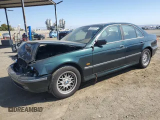 2000 BMW 5 Series 528iA with VIN WBADM6345YGU18707, listed as a Copart auction lot 63293814 with 0 mi miles and Salvage Title. Bid and sale history available at carsss.com. Image 1.