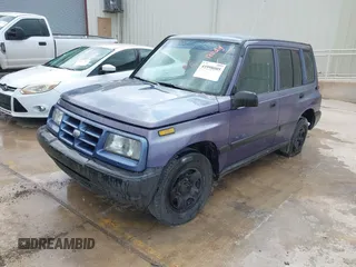 1996 Geo Tracker z VIN 2CNBE1361T6901708, wystawiony jako IAAI lot #41998005 z przebiegiem 223 266 mil mil oraz . Historia ofert i sprzedaży dostępna na DreamBid. Obrazek 2.