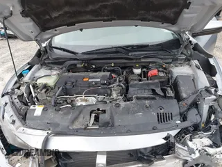2017 Honda Civic LX z VIN 2HGFC2F51HH562496, wystawiony jako IAAI lot #41524243 z przebiegiem Nie podano mil oraz . Historia ofert i sprzedaży dostępna na DreamBid. Obrazek 10.