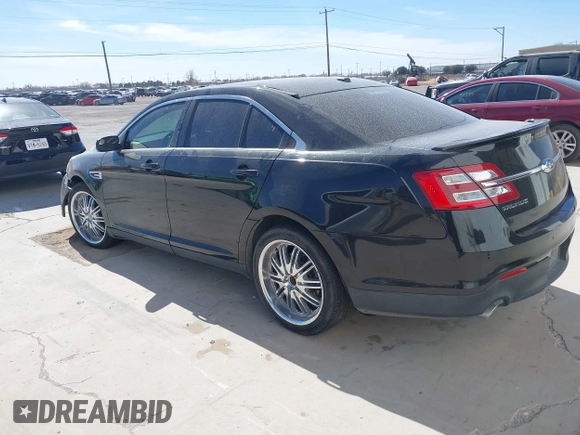 2014 Ford Taurus SEL with VIN 1FAHP2E83EG184976, listed as a IAAI auction lot 41590153 with 177,342 mi miles. Bid and sale history available at carsss.com. Image 3.