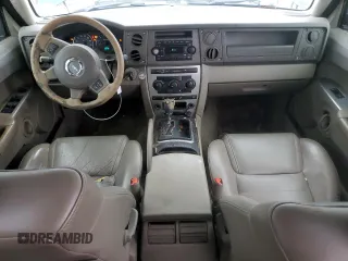 2006 Jeep Commander with VIN 1J8HH48NX6C125803, listed as a Copart auction lot 71247304 with 214,297 mi miles and Salvage Title. Bid and sale history available at carsss.com. Image 8.