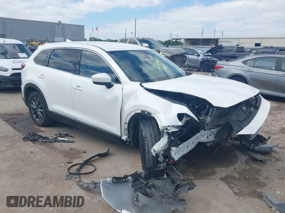 2022 Mazda CX-9 Touring with VIN JM3TCBCY0N0608052, listed as a IAAI auction lot 42027465 with 65,313 mi miles and . Bid and sale history available at DreamBid. Image 1.