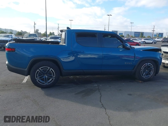 2025 Rivian R1T Adventure z VIN 7FCTGBAA9SN035986, wystawiony jako IAAI lot #41510257 z przebiegiem 2 102 mil mil oraz . Historia ofert i sprzedaży dostępna na DreamBid. Obrazek 14.