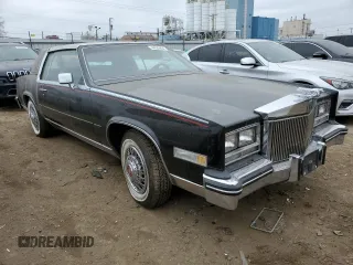 1985 Cadillac Eldorado z VIN 1G6EL5782FE634074, wystawiony jako Copart lot #44520964 z przebiegiem 74 425 mil mil oraz Szkody całkowita. Historia ofert i sprzedaży dostępna na DreamBid. Obrazek 4.