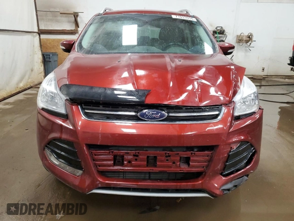 2016 Ford Escape Titanium with VIN 1FMCU9J95GUC57205, listed as a Copart auction lot 71033934 with 90,477 mi miles and Salvage Title. Bid and sale history available at DreamBid. Image 5.