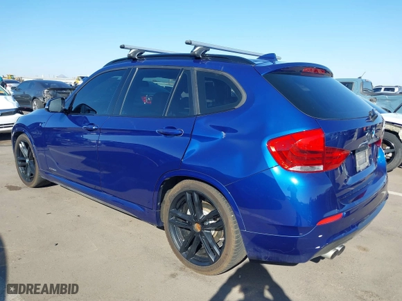 2015 BMW X1 xDrive28i with VIN WBAVL1C56FVY32753, listed as a IAAI auction lot 41759454 with 130,823 mi miles. Bid and sale history available at carsss.com. Image 3.