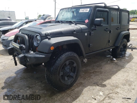 2013 Jeep Wrangler Unlimited Rubicon 10th Anniversary with VIN 1C4HJWFGXDL543660, listed as a Copart auction lot 61462104 with 115,897 mi miles and Salvage title. Bid and sale history available at DreamBid. Image 1.