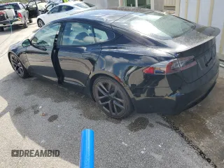 2022 Tesla Model S Plaid z VIN 5YJSA1E64NF461218, wystawiony jako Copart lot #74178794 z przebiegiem Nie podano mil oraz Szkoda całkowita • Salvage title. Historia ofert i sprzedaży dostępna na DreamBid. Obrazek 2.