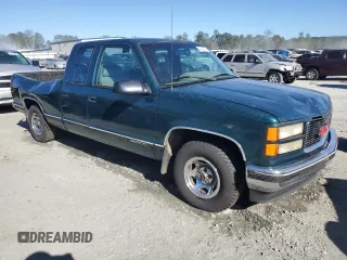 1996 GMC Sierra 1500 with VIN 2GTEC19W4T1542916, listed as a Copart auction lot 75097274 with 310,745 mi miles and Salvage Title. Bid and sale history available at DreamBid. Image 4.
