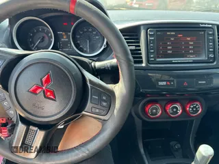 2012 Mitsubishi Lancer Evolution GSR z VIN JA32W8FV0CU019216, wystawiony jako Copart lot #75898944 z przebiegiem 129 387 mil mil oraz Tytuł czysty. Historia ofert i sprzedaży dostępna na DreamBid. Obrazek 9.