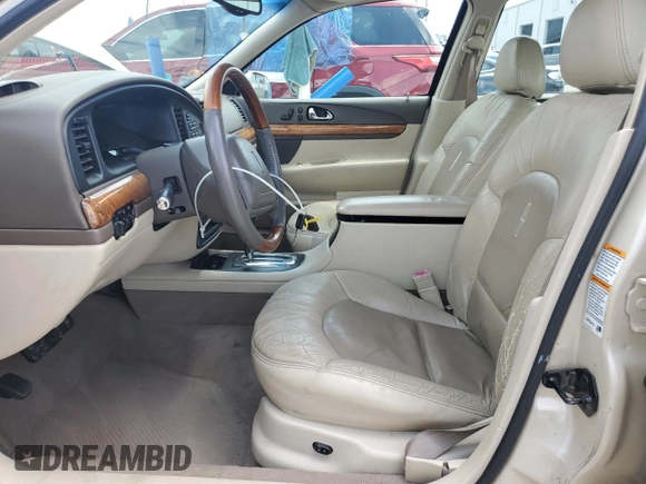 2001 Lincoln Continental z VIN 1LNHM97V91Y622267, wystawiony jako Copart lot #59915445 z przebiegiem 77 070 mil mil oraz Szkoda całkowita • Salvage title. Historia ofert i sprzedaży dostępna na DreamBid. Obrazek 7.