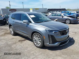 2022 Cadillac XT6 Premium Luxury z VIN 1GYKPDRS4NZ146284, wystawiony jako IAAI lot #42150678 z przebiegiem 28 890 mil mil oraz . Historia ofert i sprzedaży dostępna na DreamBid. Obrazek 1.