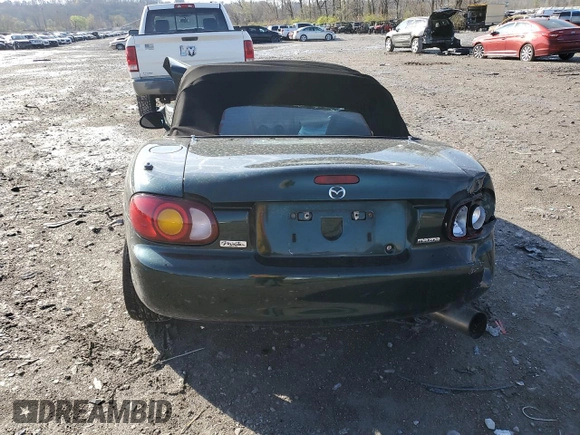 1999 Mazda MX-5 Miata z VIN JM1NB3536X0133733, wystawiony jako Copart lot #50906215 z przebiegiem Nie podano mil oraz Szkoda całkowita • Salvage title. Historia ofert i sprzedaży dostępna na DreamBid. Obrazek 6.