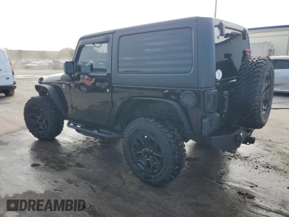 2017 Jeep Wrangler Willys Wheeler with VIN 1C4AJWAG1HL624254, listed as a Copart auction lot 42678975 with 51,936 mi miles and Salvage Title. Bid and sale history available at DreamBid. Image 2.