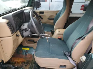 2000 Jeep Wrangler Sahara with VIN 1J4FA59S1YP747919, listed as a Copart auction lot 72278044 with 157,360 mi miles and Salvage Title. Bid and sale history available at carsss.com. Image 7.