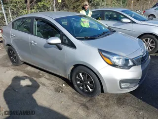 2014 Kia Rio EX with VIN KNADN4A31E6385704, listed as a IAAI auction lot 41245821 with 130,085 mi miles. Bid and sale history available at carsss.com. Image 1.